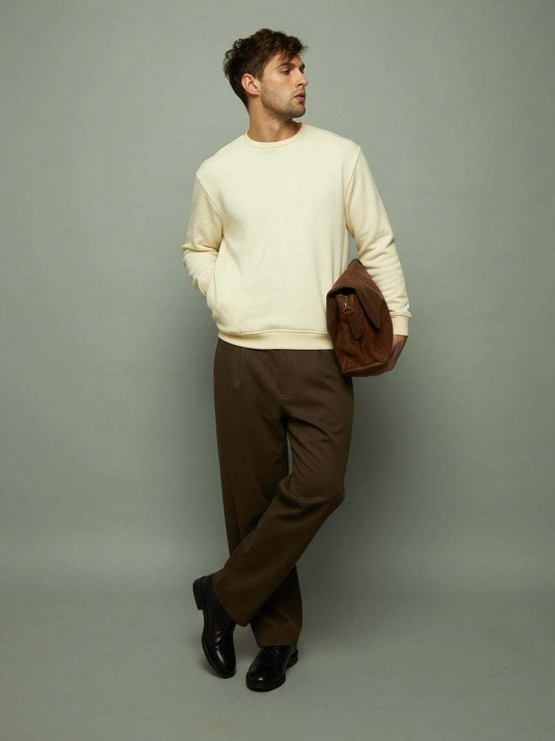Man wearing an ecru sweatshirt